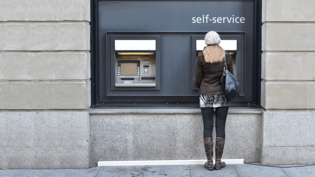 Woman uses ATM